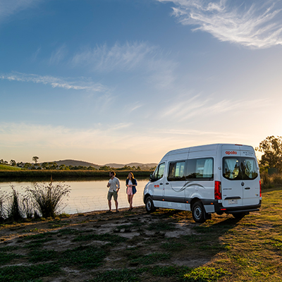 a couple stand near a lake in the Yarra Valley